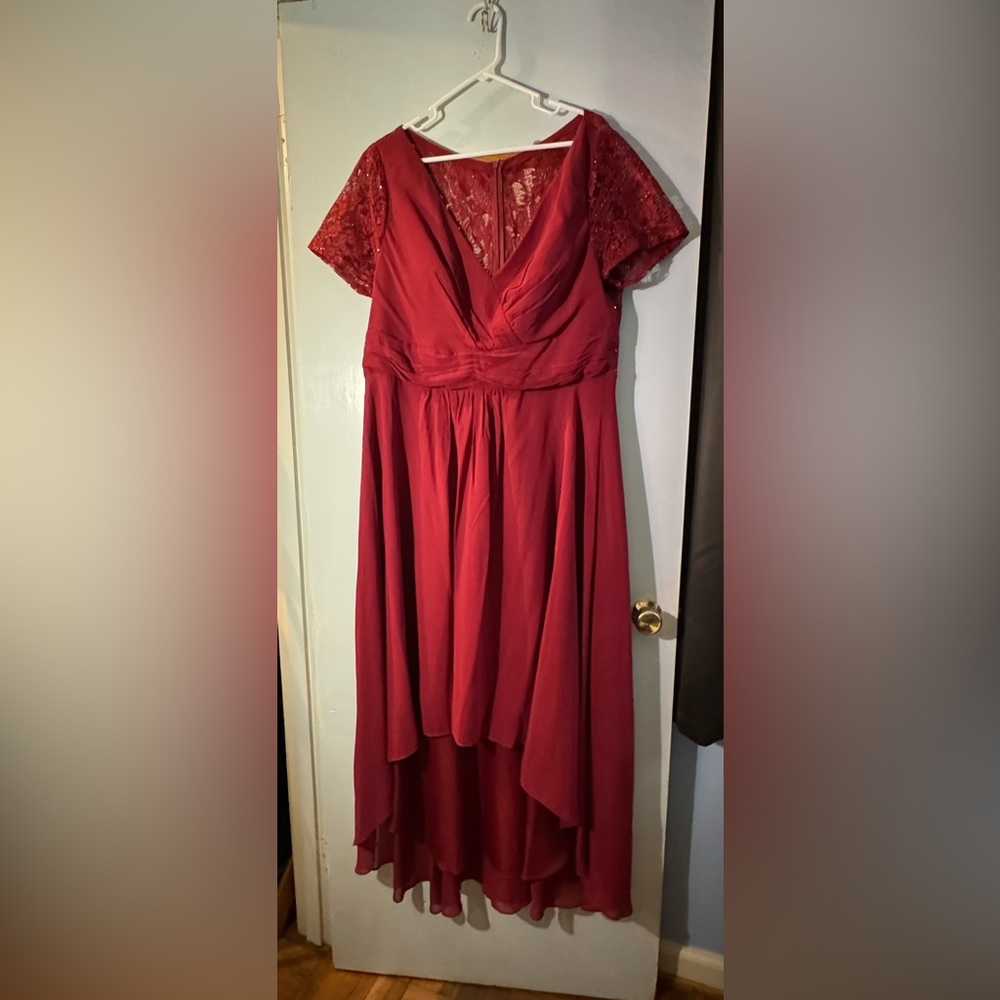 Never been worn! Bought for a wedding I never attended. Sleeves are a bit snug.